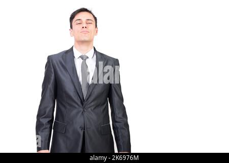 Confident man in elegant suit with closed eyes Stock Photo