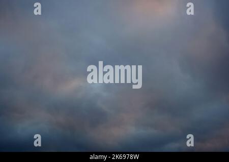 Background of soft colors fluffy clouds at twilight. Tinted pastel cool colors of cloudy sky at twilight in winter Stock Photo