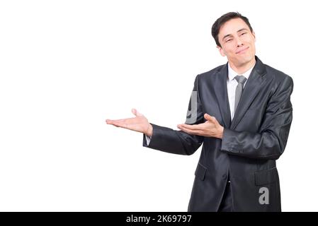 Smiling businessman pointing aside with hands showing advertisement Stock Photo