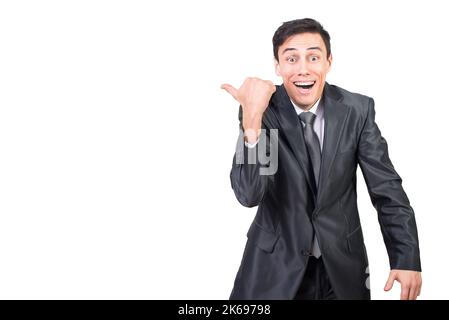 Cheerful businessman pointing aside and smiling happily Stock Photo