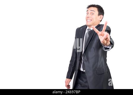 Cheerful man in suit showing v sign Stock Photo