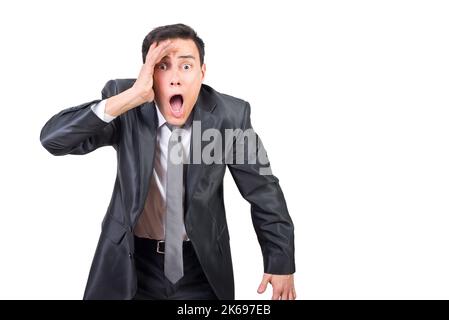 Surprised man in suit looking at camera Stock Photo