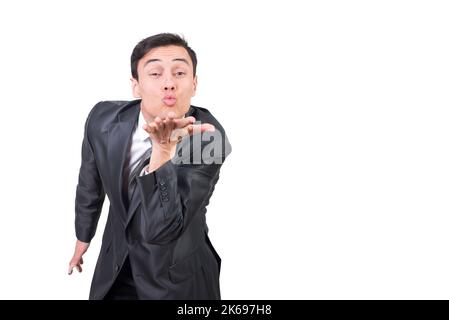 Man in elegant suit sending air kiss Stock Photo