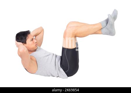Strong sportsman in activewear performing abdominal crunches Stock Photo