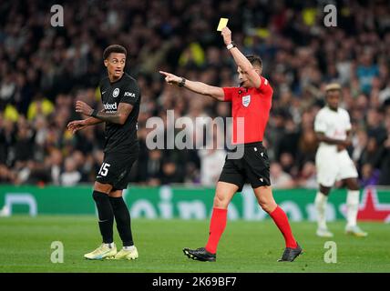 Eintracht Frankfurt's Lucas Tuta is shown a yellow card by referee Carlos del Cerro Grande during the UEFA Champions League Group D match at the Tottenham Hotspur Stadium, London. Picture date: Wednesday October 12, 2022. Stock Photo