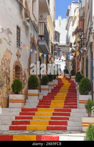 Steps painted in the colour of the Spanish Flag. Calpe, Alicante, Spai Stock Photo