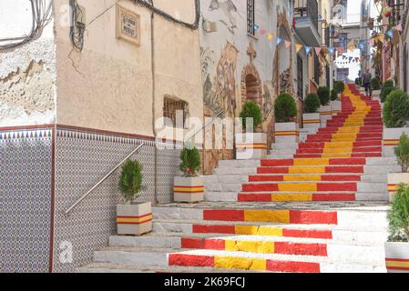 Steps painted in the colour of the Spanish Flag. Calpe, Alicante, Spai Stock Photo