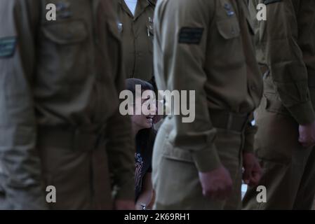 (221012) -- GEDERA (ISRAEL), Oct. 12, 2022 (Xinhua) -- Soldiers and relatives attend the funeral of an Israeli soldier at the military cemetery in Gedera, central Israel, on Oct. 12, 2022. The Israeli soldier was killed in a drive-by shooting attack in the occupied West Bank on Tuesday, amid escalating violence between Israel and the Palestinians. (Ilan Assayag/JINI via Xinhua) Stock Photo