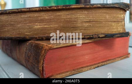 Old leather-bound books side view Stock Photo