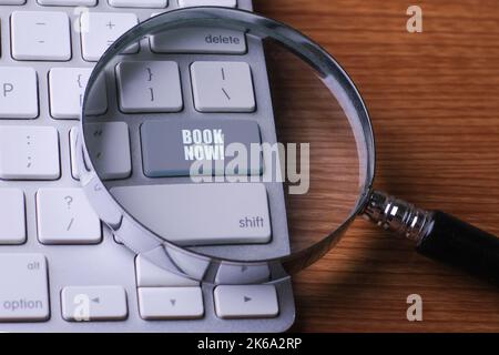 BOOK NOW WORD on computer keyboard background Stock Photo