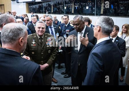 Brussels, Belgium. 12th Oct, 2022. Left to right: US Chief of Defense General Mark A. Milley, US Secretary of Defense Lloyd J. Austin III and NATO Secretary General Jens Stoltenberg chat to each other during the NATO defense ministers meeting in Brussels, Belgium on Wednesday, October 12, 2022. Defense ministers of NATO member states met on Wednesday in Brussels to discuss ways to provide military aid for Ukraine. Photo by NATO/UPI Credit: UPI/Alamy Live News Stock Photo