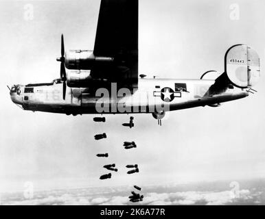 A B-24 Liberator releasing bombs over the rail yards at Muhldorf, Germany in 1945. Stock Photo