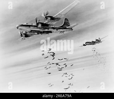 A pair of B-29 Superfortress bombers dropping bombs during World War II. Stock Photo