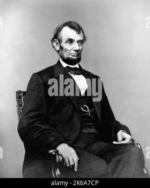 President Abraham Lincoln sitting in chair. Stock Photo