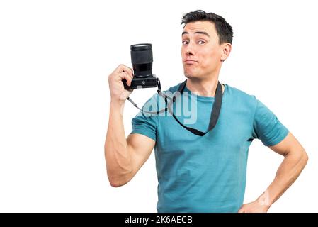 Confident man with photo camera in studio Stock Photo