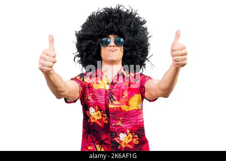 Confident male in Afro wig gesturing thumbs up Stock Photo