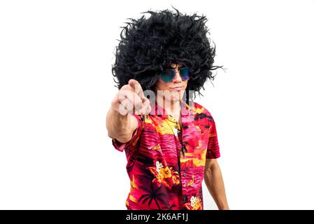 Self assured man in Afro wig pointing at camera Stock Photo