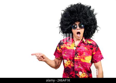 Astonished man in Afro wig pointing away Stock Photo
