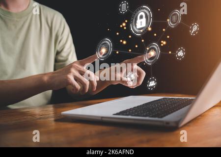 Cloud computing technology concept. Man is touch hologram and using notebook (Laptop). Internet storage network system. Big data and business. Stock Photo