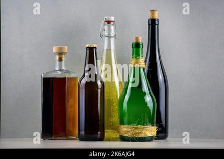 A closeup of different types of drinks in gray background Stock Photo