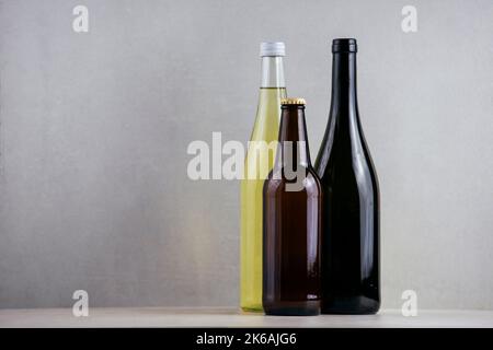 A closeup of different types of drinks in gray background with copyspace Stock Photo