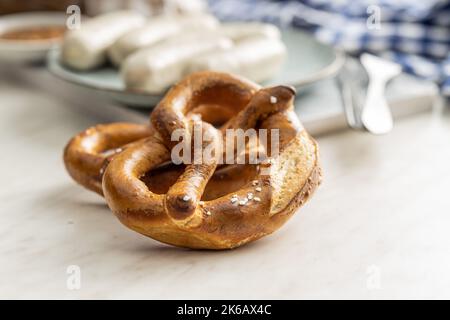Baked bavarian pretzels on the white table. Stock Photo