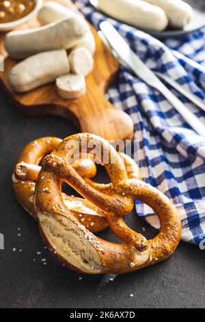 Baked bavarian pretzels on the black table. Stock Photo
