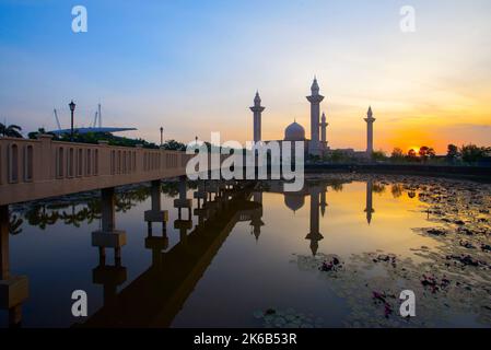 Reflection of beautiful Ampuan Jemaah mosque during sunrise Stock Photo