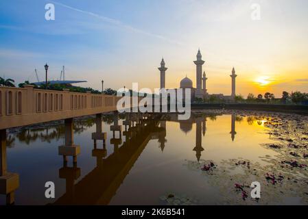 Reflection of beautiful Ampuan Jemaah mosque during sunrise Stock Photo