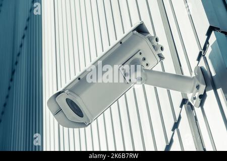 Outdoor street CCTV Security camera installed on the building wall in the city Stock Photo