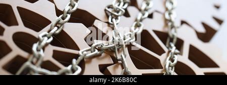 Gears connected by metal chain and business achievement Stock Photo