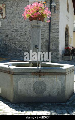 Ancient stone mountain fountains in the medieval center of Sauze d'Oulx in the upper Val di Susa Stock Photo