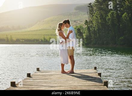 Lets take it in. a young couple spending time together at a lake. Stock Photo