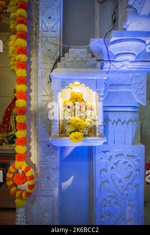 A small idol of Lord Ganesha being worshipped at a temple in Mumbai, India Stock Photo