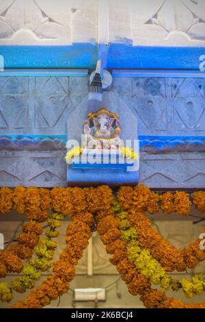 A small idol of Lord Ganesha being worshipped at a temple in Mumbai, India Stock Photo