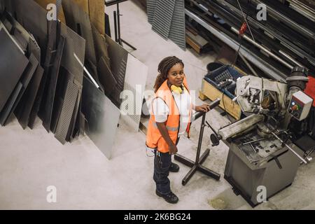High angle view of female carpenter working in workshop Stock Photo