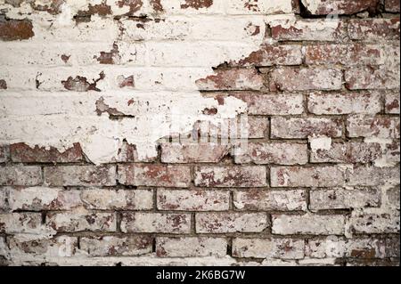 Old Brick Wall with Peeling Flaking Paint Stock Photo