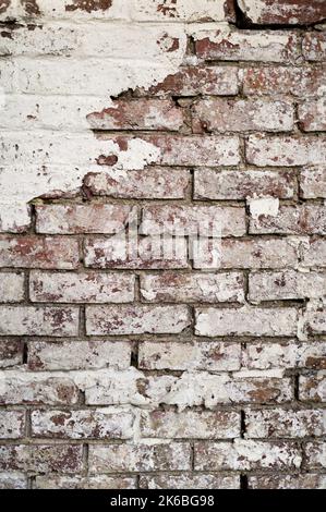 Old Brick Wall with Peeling Flaking Paint Stock Photo