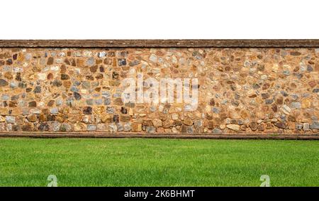 Panoramic view of the old vintage stone wall and green lawn at a garden as landscape design Stock Photo