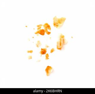 Falling crumbs by puff dough isolated on white Stock Photo