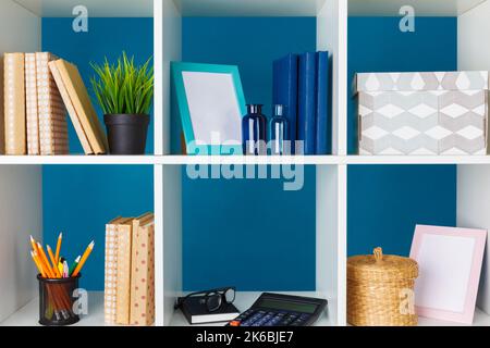 White office shelves with different stationery, close up Stock Photo