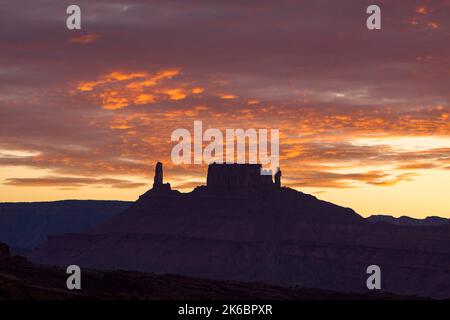 Colorful sunset clouds over the Castleton Tower / Castle Rock, the Rectory and Priest and Nuns near Moab, Utah. Stock Photo