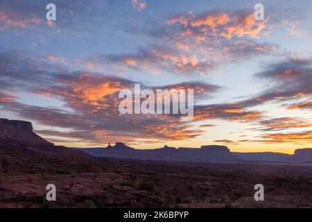 Colorful sunset clouds over the Castleton Tower / Castle Rock, the Rectory and Priest and Nuns near Moab, Utah.  The Mother Superior rock formation is Stock Photo