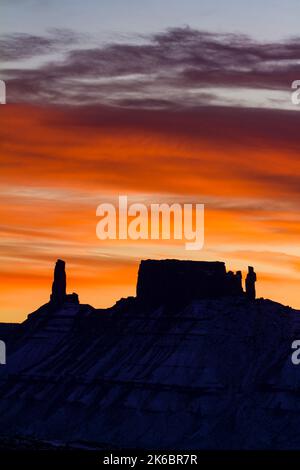 Colorful sunset clouds over the Castleton Tower / Castle Rock, the Rectory and Priest and Nuns near Moab, Utah. Stock Photo