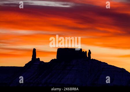 Colorful sunset clouds over the Castleton Tower / Castle Rock, the Rectory and Priest and Nuns near Moab, Utah. Stock Photo