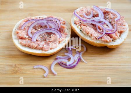 rolls with minced meat and onion rings Stock Photo