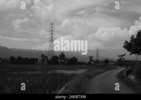 Monochrome photo, view of signal tower and electricity distribution tower, Cikancung - Indonesia Stock Photo