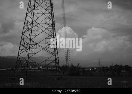 Monochrome photo, view of signal tower and electricity distribution tower, Cikancung - Indonesia Stock Photo