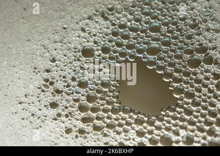 Foam bubbles on the water close up, abstract background Stock Photo