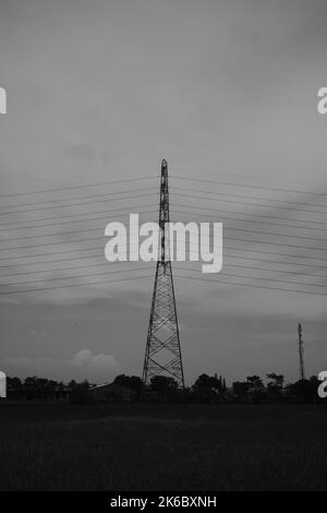 Monochrome photo, view of signal tower and electricity distribution tower, Cikancung - Indonesia Stock Photo